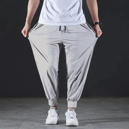 Summer Quick-drying Ice Silk Casual Pants Men's Ultra-thin Elastic Nine-point Pants Loose Drape Solid Beam Feet Pants 7XL