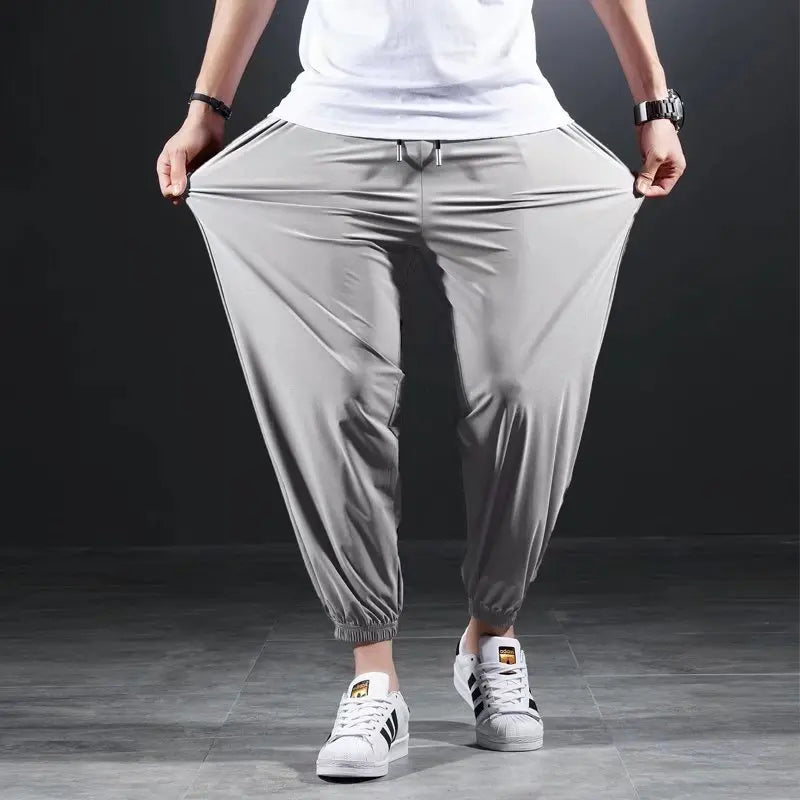 Summer Quick-drying Ice Silk Casual Pants Men's Ultra-thin Elastic Nine-point Pants Loose Drape Solid Beam Feet Pants 7XL Light grey