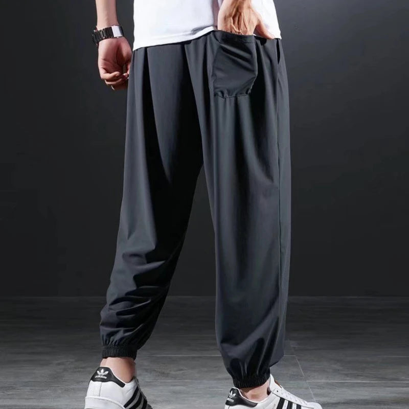 Summer Quick-drying Ice Silk Casual Pants Men's Ultra-thin Elastic Nine-point Pants Loose Drape Solid Beam Feet Pants 7XL